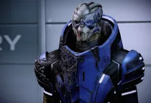 Garrus, a turian character wearing blue armor, shown in close-up.