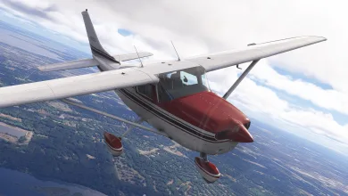 A white Carenado CT206 with a red nose and wheel fairings flies above a forested landscape.