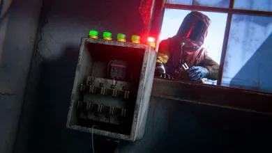 A Rust player stands beside an open heavy fuse box with indicator lights in an industrial room.