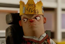 A stern-looking stylized Citizen character wearing a cardboard crown in s&box.