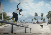 A skate. player grinds a rail at a sunny skatepark lined with palm trees.