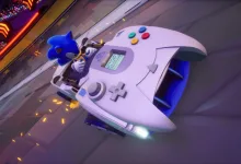 Sonic drives a white Dreamcast-controller-shaped vehicle on a neon-lit track in Sonic Racing: CrossWorlds.