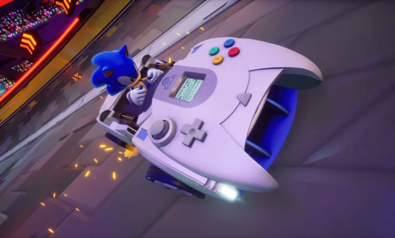 Sonic drives a white Dreamcast-controller-shaped vehicle on a neon-lit track in Sonic Racing: CrossWorlds.