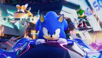 Sonic races in the foreground while Tails and another racer speed behind him in Sonic Racing: CrossWorlds.