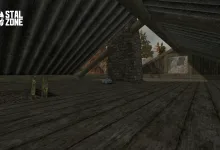 A small box sits on the floor of a dim wooden attic beneath a sloped roof.