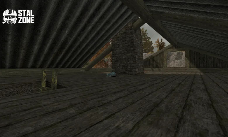A small box sits on the floor of a dim wooden attic beneath a sloped roof.