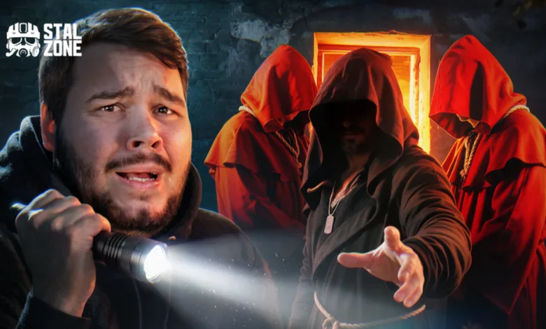 A flashlight-bearing man stands before a hooded figure and red-robed companions.