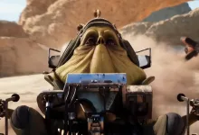 A Star Wars: Galactic Racer vehicle speeds through a desert canyon with another racer visible in the background.