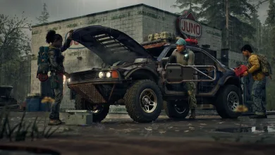 Three survivors work around an off-road vehicle outside a Juno building in the rain.
