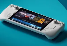 A white Steam Deck handheld gaming PC displaying its game library on screen.