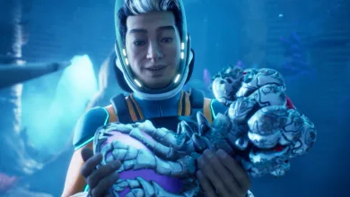 A diver in a Subnautica 2 suit holds a pale alien creature underwater.