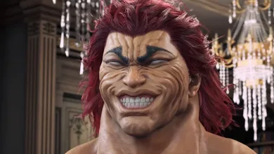 Close-up of red-haired Yujiro smiling in an ornate interior.