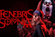 A woman in a red hood stands before a towering pale monster in Tenebris Somnia key art.