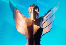 A stylized gold statuette with outstretched wings against a bright blue background.