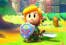 Link stands in a grassy area holding a sword and shield in The Legend of Zelda: Link’s Awakening.
