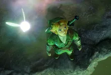 Link looks upward beside a glowing fairy in a rocky chamber in The Legend of Zelda: Ocarina of Time remake.
