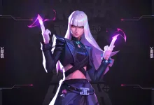 A white-haired VALORANT agent raises her hands amid glowing pink energy against a dark purple background.