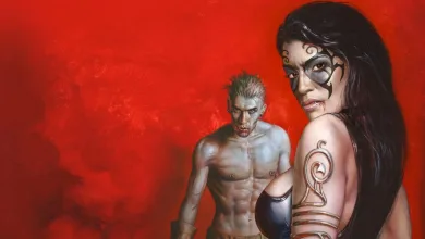 A dark-haired woman with facial markings stands in front of a pale, fanged man against a red background.