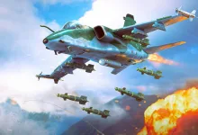 A War Thunder aircraft flies over a battlefield as several bombs fall toward an explosion.