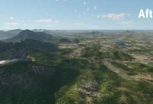 Aerial view of Southeastern City’s rebuilt terrain, with forested mountains, lakes, and villages.
