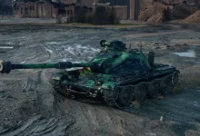 A green-camouflaged World of Tanks tank sits on muddy ground in front of damaged buildings.