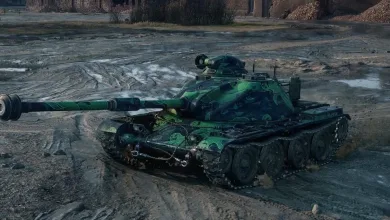 A green-camouflaged World of Tanks tank sits on muddy ground in front of damaged buildings.