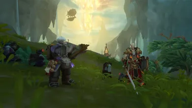 Several World of Warcraft characters stand in a cavern beneath a brilliant golden crystal.